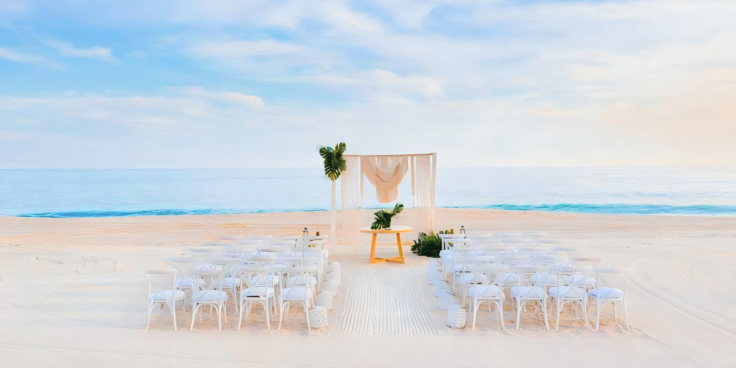 Beachfront wedding ceremony setup with arch and ocean views at Zoëtry Casa del Mar Los Cabos