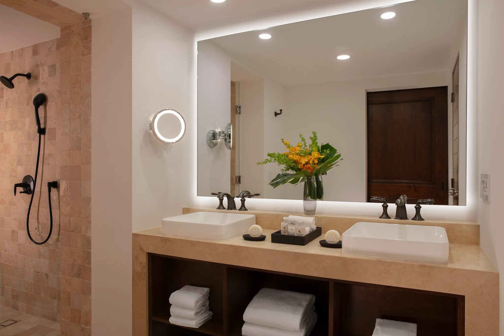 Deluxe Ocean View Room bathroom with double vanity and rain shower at Zoëtry Casa del Mar Los Cabos.