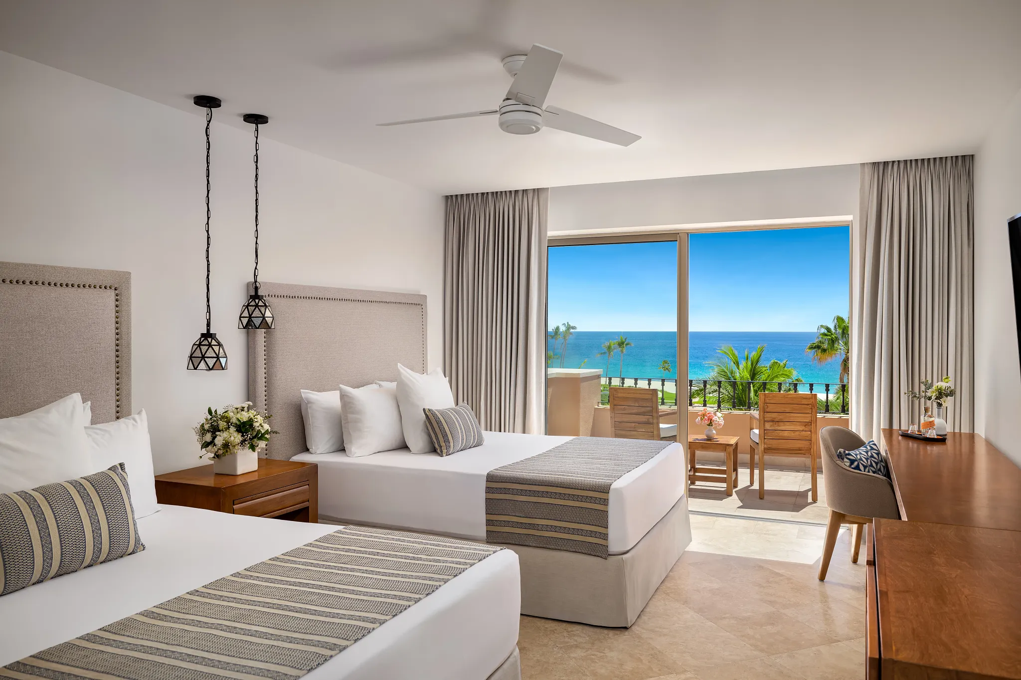 Deluxe Ocean View Room with two double beds and ocean-view balcony at Zoëtry Casa del Mar Los Cabos.