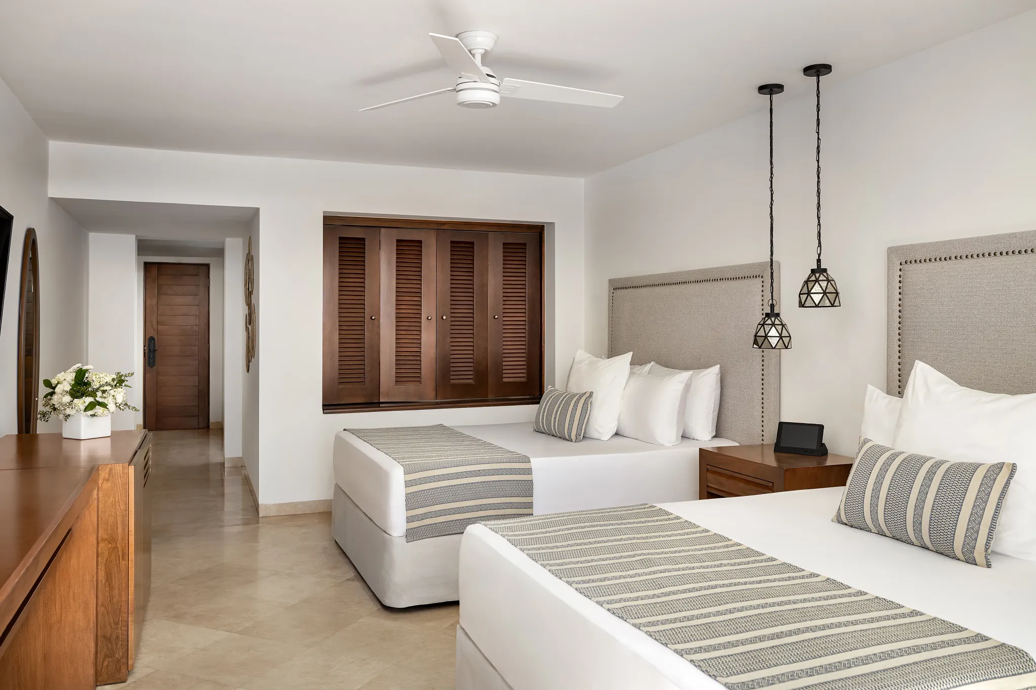 Deluxe Ocean View Room interior with two double beds at Zoëtry Casa del Mar Los Cabos.