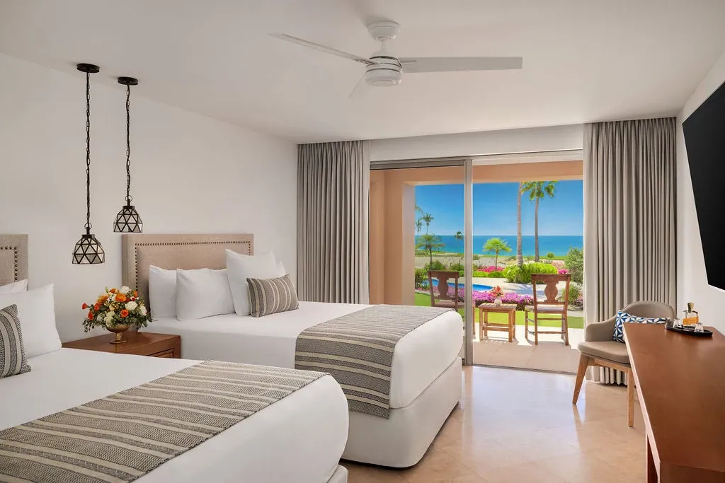 Junior Suite Ocean View with two double beds at Zoëtry Casa del Mar Los Cabos.