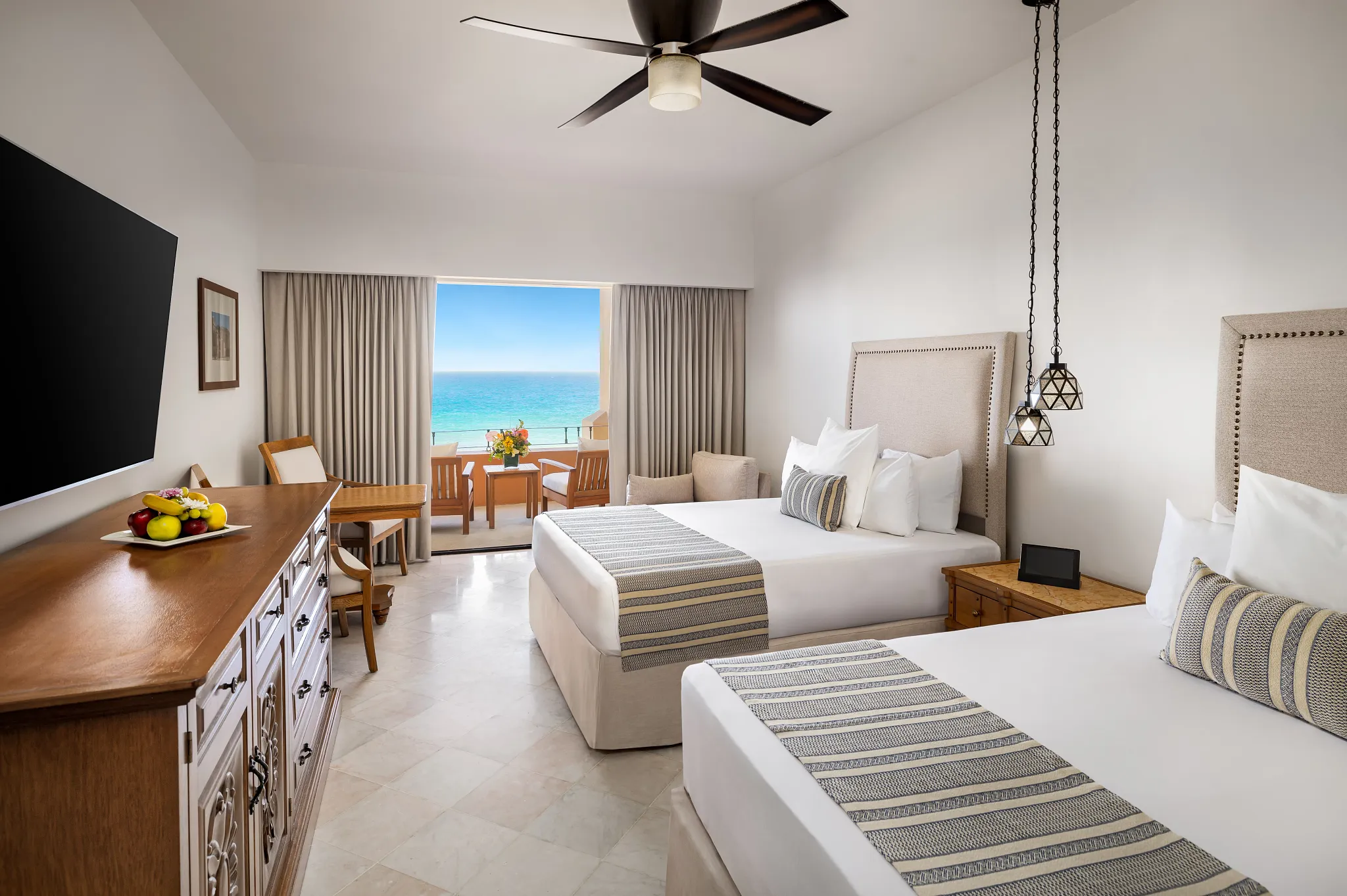 Junior Suite Oceanfront with two double beds and balcony view at Zoëtry Casa del Mar Los Cabos.