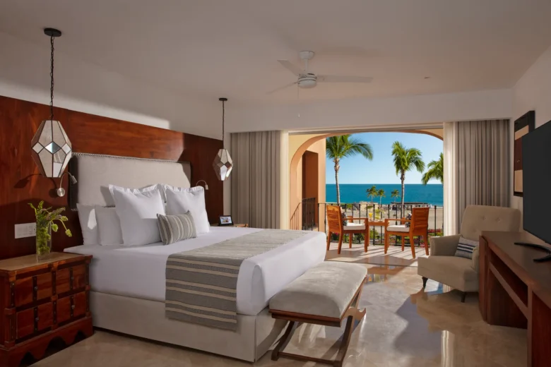 Master Two Bedroom Suite partial ocean view bedroom with king bed and terrace at Zoëtry Casa del Mar Los Cabos.