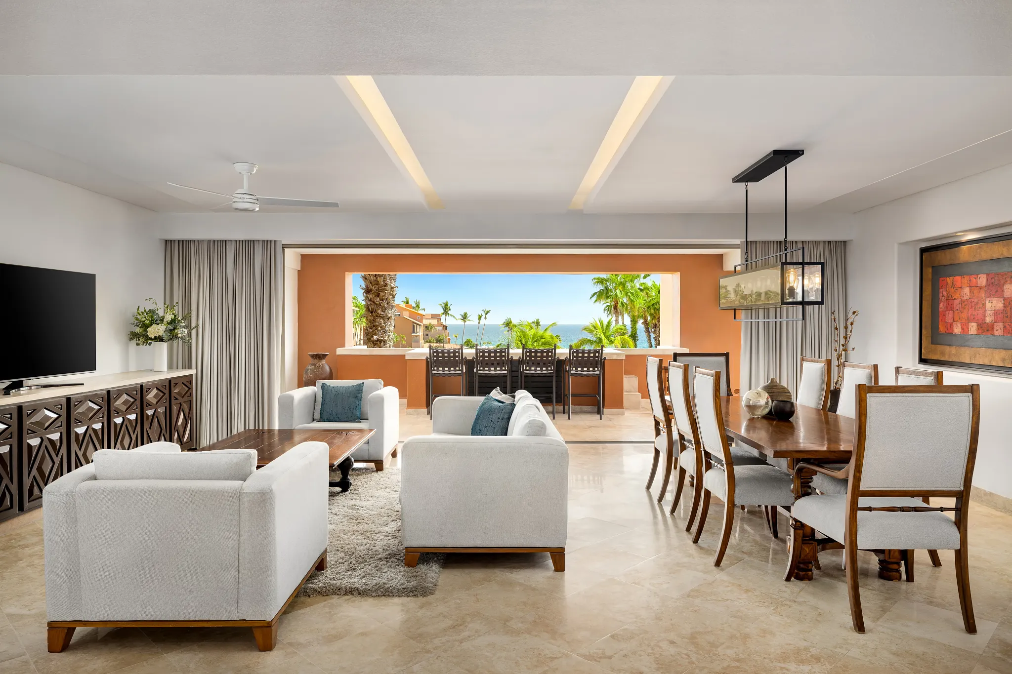 Presidential Two Bedroom Suite living and dining area with ocean view terrace at Zoëtry Casa del Mar Los Cabos.