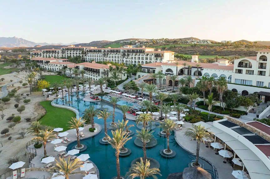 Secrets Puerto Los Cabos adults-only all-inclusive resort with pools, golf course views, and beachfront setting.