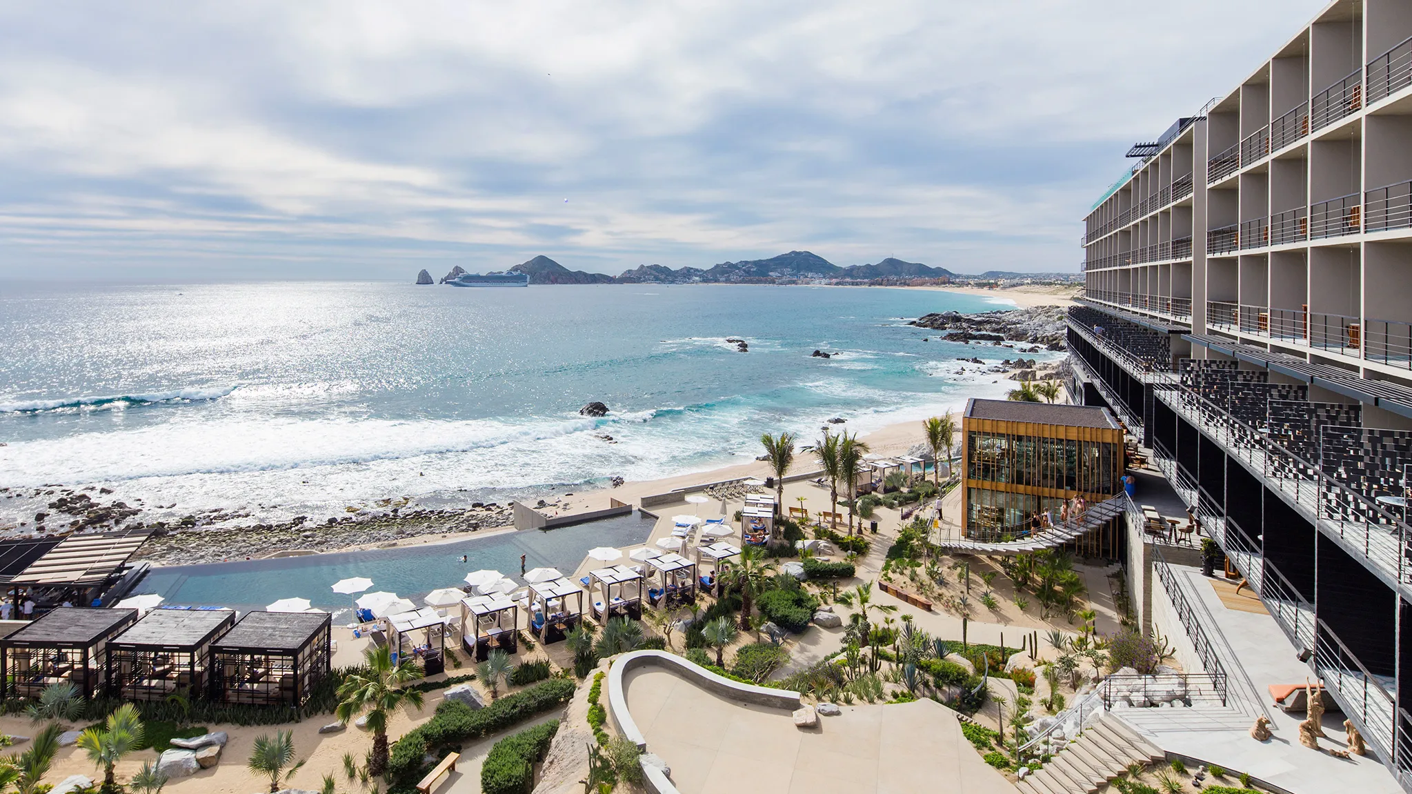 The Cape Thompson Hotel Los Cabos with rooftop lounge and ocean views of El Arco in Cabo San Lucas.
